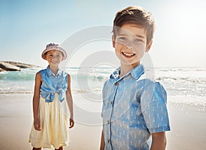 Were here for a day of fun in the sun. Portrait of two adorable little children playing at the beach.