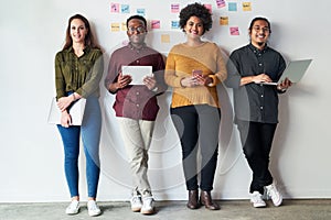 Were keeping the connection going strong. Full length shot of a group of a young businesspeople standing together and