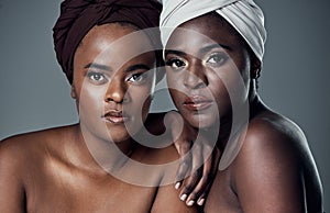 Were keeping our beautiful heritage and traditions alive. Studio portrait of two beautiful young women posing against a