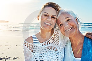 Were two of a kind. Cropped portrait of a senior woman and her adult daughter spending a day at the beach.
