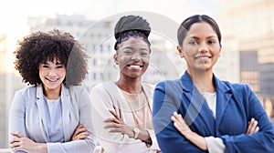 Were women destined for success. a diverse group of businesswomen standing outside on the balcony with their arms folded