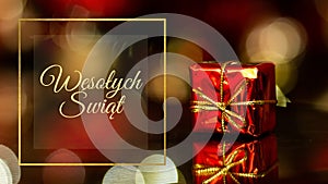 WesoÅ‚ych Å›wiÄ…t - red Christmas gift on the background of lights, christmas time