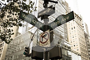 West 42nd Street, Fifth Ave, One way, No turn signs and traffic light on the pole in old vintage style