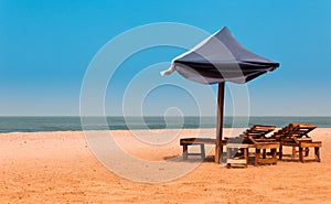 West africa Gambia - chairs and umbrellas on a paradise beach