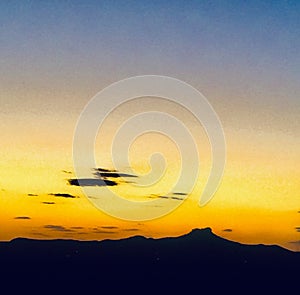 Sunset behind mountain