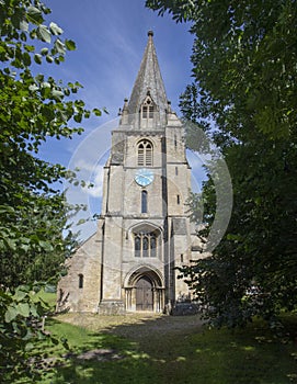 The west door and tower of St Mary\'s Church Shipton Under Wychwood