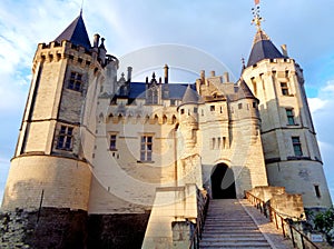 West facade and entrance to the castle of Saumur at dusk