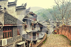 West Gate Wall along with hertable residences in Fenghuang old city Phoenix Ancient Town, Hunan Province, China