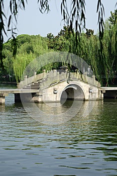 West lake with stone bridge