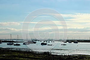 West Mersea estuary at dusk with bobbing boats