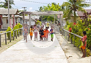 Indigenous children in a street of local village playing