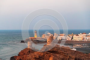 West part of Sur town with Al-Ayjah Lighthouse and Al-Ayjah Castle in golden hour time, Oman