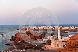 West part of Sur town with Al-Ayjah Lighthouse and Al-Ayjah Castle in golden hour time, Oman