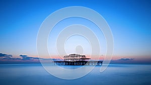 The west pier of Brighton after sunset, England, UK