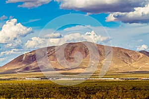 West Texas Mountains, with a Train, Clouds and Blue Sky.