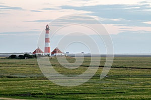 Westerheversand lighthouse at a cludy day