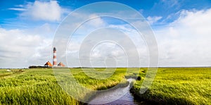 Westerheversand lighthouse at North Sea, Schleswig-Holstein, Germany photo