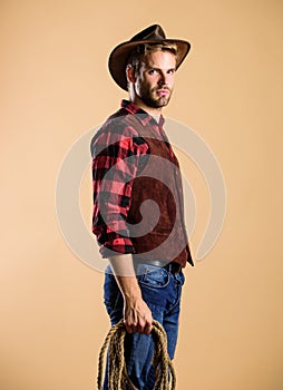 Western america. cowboy with lasso rope. Western. Vintage style man. Wild West retro cowboy. man checkered shirt on