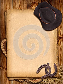 Western background with cowboy hat and horseshoe. photo