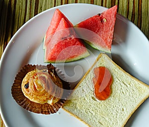 Western breakfast with bread butter, jam