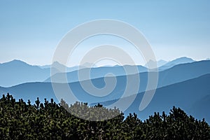 Mountain top panorama in autumn covered in mist or clouds