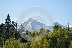 Mountain tops in autumn covered in mist or clouds