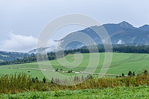 Mountain tops in autumn covered in mist or clouds