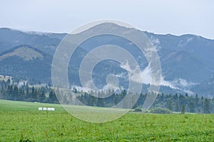 Mountain tops in autumn covered in mist or clouds