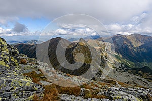 Mountain tops in autumn covered in mist or clouds