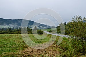 Mountain tops in autumn covered in mist or clouds