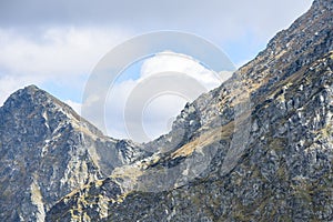 Mountain tops in autumn covered in mist or clouds