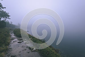 Misty morning view in wet mountain area in slovakian tatra. tour