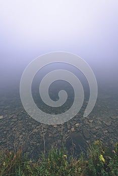 Misty morning view in wet mountain area in slovakian tatra - vintage film look