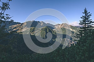 Mountain tops in autumn covered in mist or clouds - vintage ret