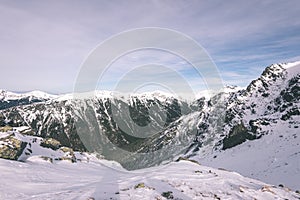 Mountain tops in winter covered in snow - vintage film look