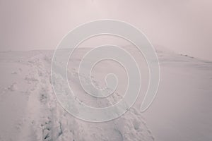 Mountain tops in winter covered in snow - vintage film look