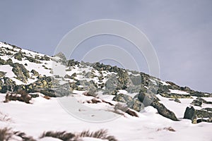 Mountain tops in winter covered in snow - vintage film look