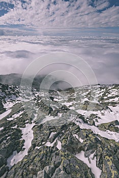 Mountain tops in winter covered in snow - vintage retro look