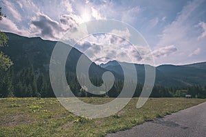 Western carpathian Tatra mountain skyline with green fields and forests in foreground. summer in Slovakian hiking trails - vintage