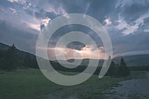 Western carpathian Tatra mountain skyline with green fields and forests in foreground. summer in Slovakian hiking trails - vintage