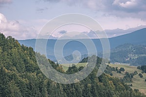 Western carpathian Tatra mountain skyline with green fields and forests in foreground. summer in Slovakian hiking trails - vintage