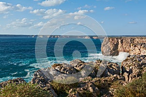 The western coastline of the Algarve. Stormy ocean with huge waves washing the cliffs, Portugal