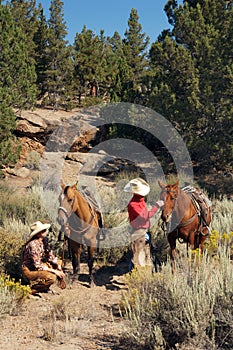 Western couple trail riding