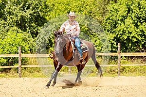 Western cowgirl woman riding horse. Sport activity