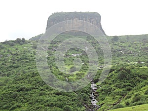 Western Ghats of India- Monsoon season- lush greenery and cloud covered hills with small waterfalls