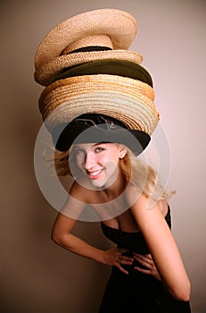 Western girl wearing many hats