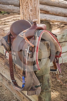Western riding saddle and horse blanket photo
