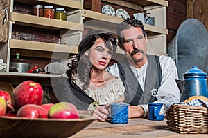 Western Sheriff and Woman Pose Inside House