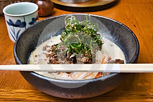 A western-style Somen noodle soup sitting on the table.