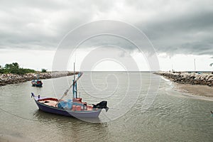 Western sunset shining on easterly clouds at Cha-um beach